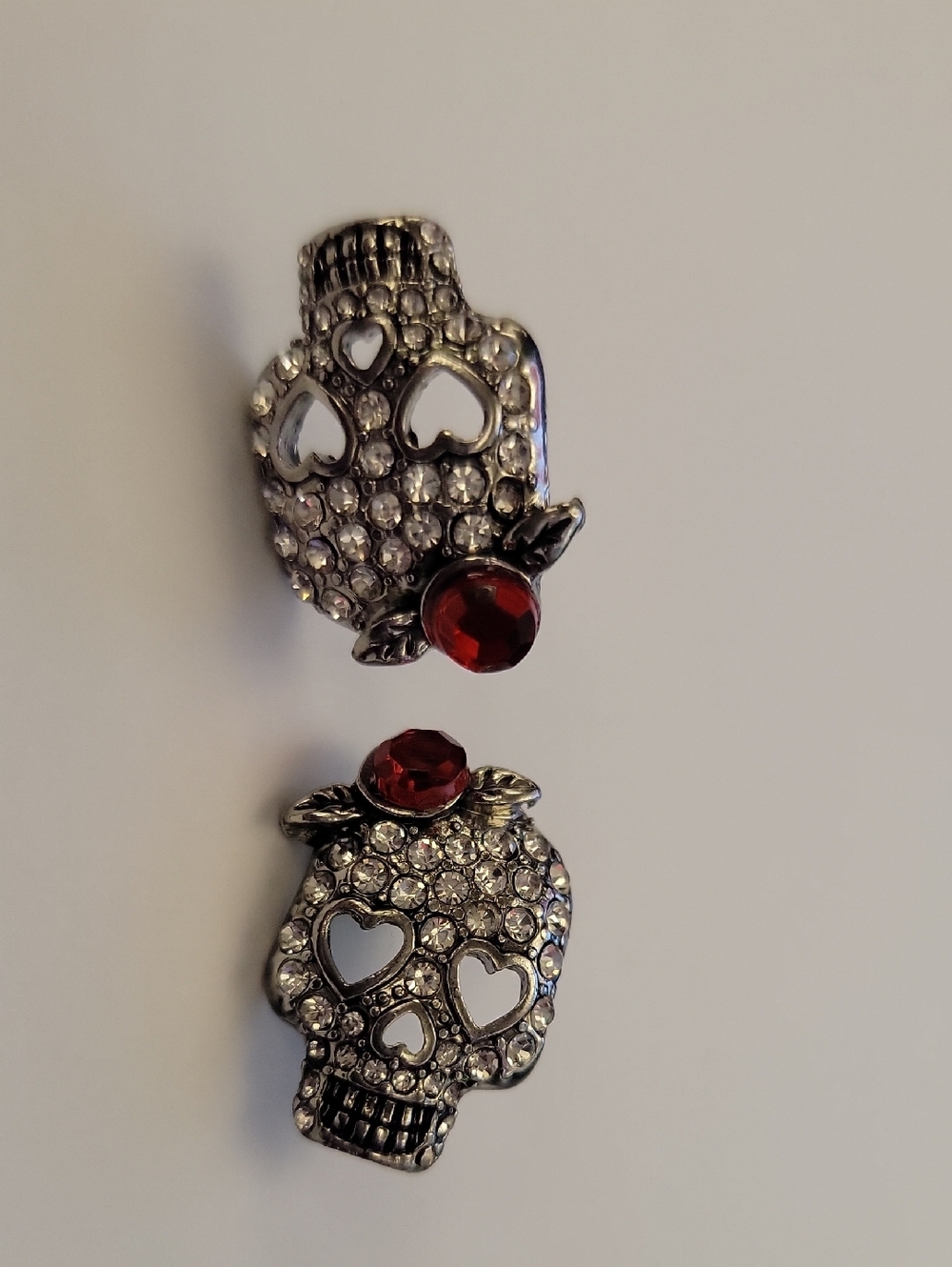 Silver Crystal Skull Earrings with Red Gem Accent